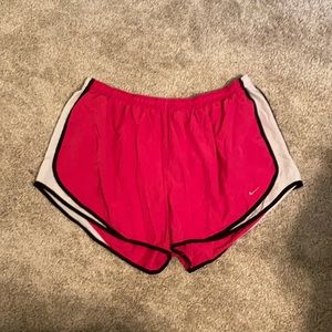 Pink Nike running shorts